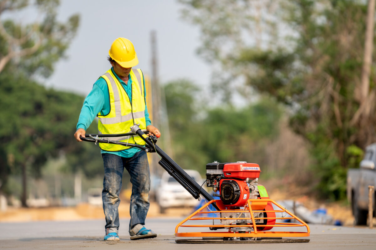 construction-worker-pouring-wet-concret-road-construction-site