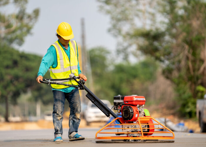 construction-worker-pouring-wet-concret-road-construction-site